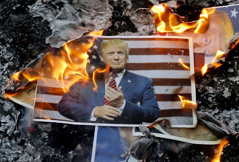 MID EAST UNREST. A portrait of US President Donald Trump burns during a demonstration in Tehran, Iran on December 11, 2017 to denounce his declaration of Jerusalem as Israel's capital. Photo by Atta Kenare/AFP 