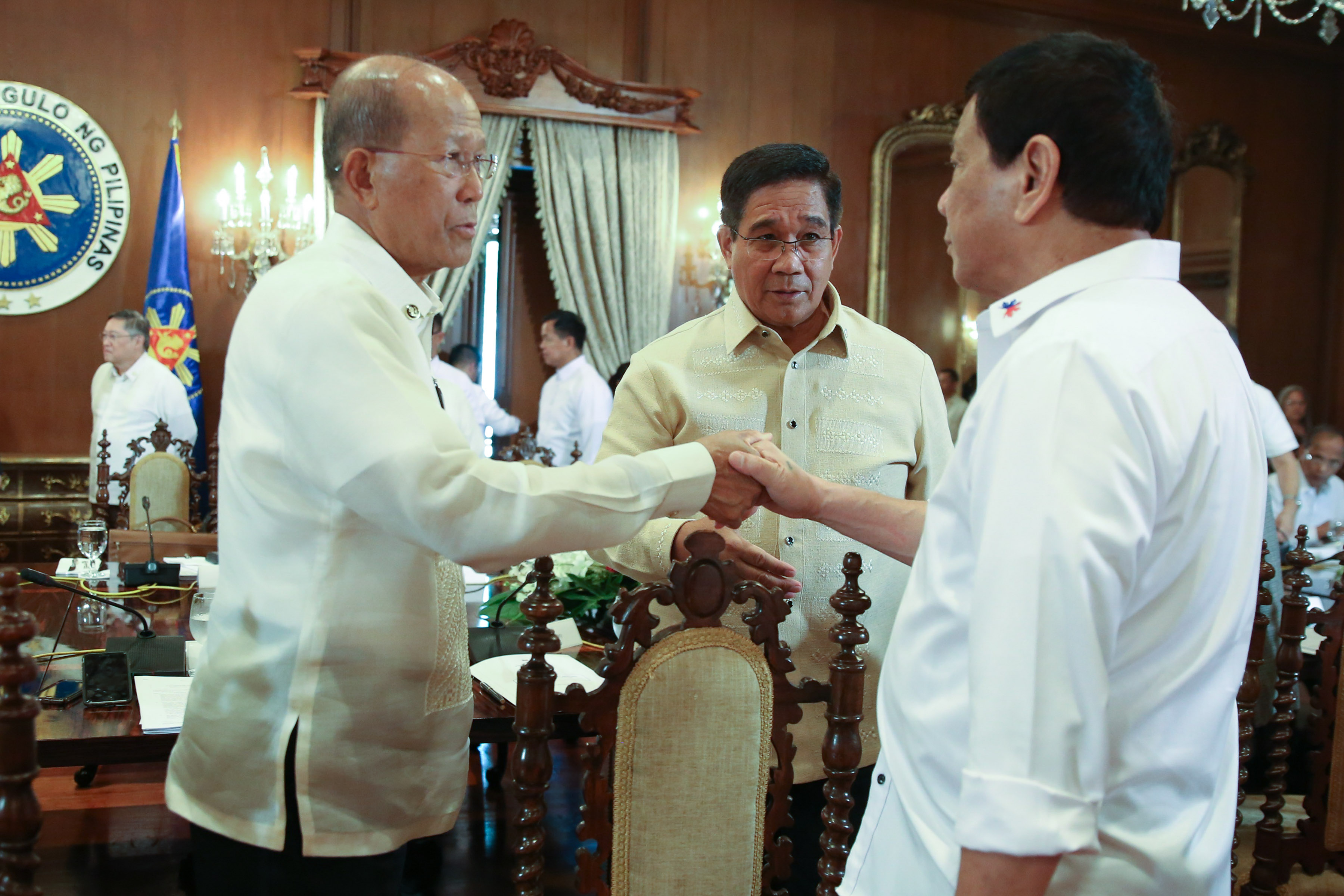 SECURITY MATTERS. President Duterte chats with his top security experts, Defense Secretary Delfin Lorenzana and National Security Adviser Hermogenes Esperon Jr during the 13th Cabinet meeting on March 6. File photo by Toto Lozano/Presidential Photo 