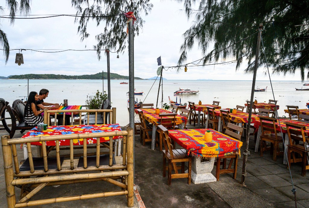 THAILAND TOURISM. In this file photo taken on October 2, 2019, a couple sits at a restaurant on Raway beach in Phuket. Photo by Mladen Antonov/AFP 