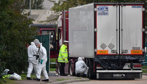 PROBE. British Police forensics officers work on lorry, found to be containing 39 dead bodies, at Waterglade Industrial Park in Grays, east of London, on October 23, 2019. Photo by Ben Stansall/AFP 