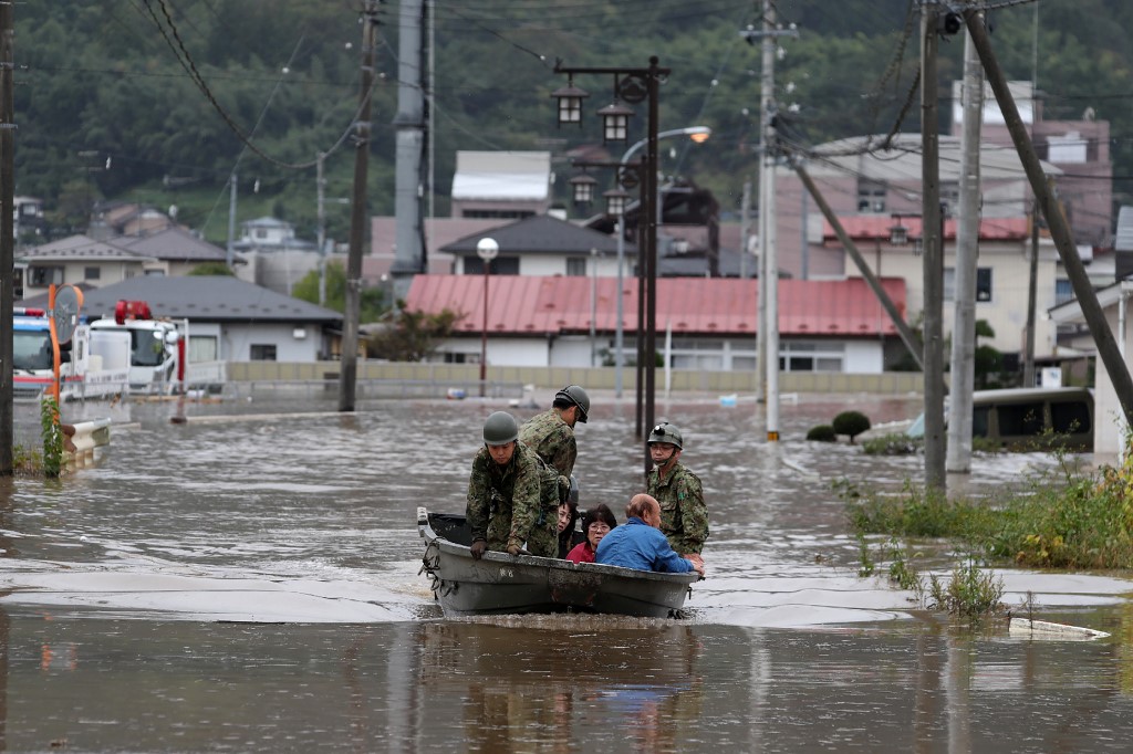 AFTERMATH. Japan Self-Defense Forces evacuate residents from a flooded area during search and rescue operations in the aftermath of Typhoon Hagibis in Marumori, Miyagi prefecture on October 14, 2019. Photo by Jiji Press//AFP 