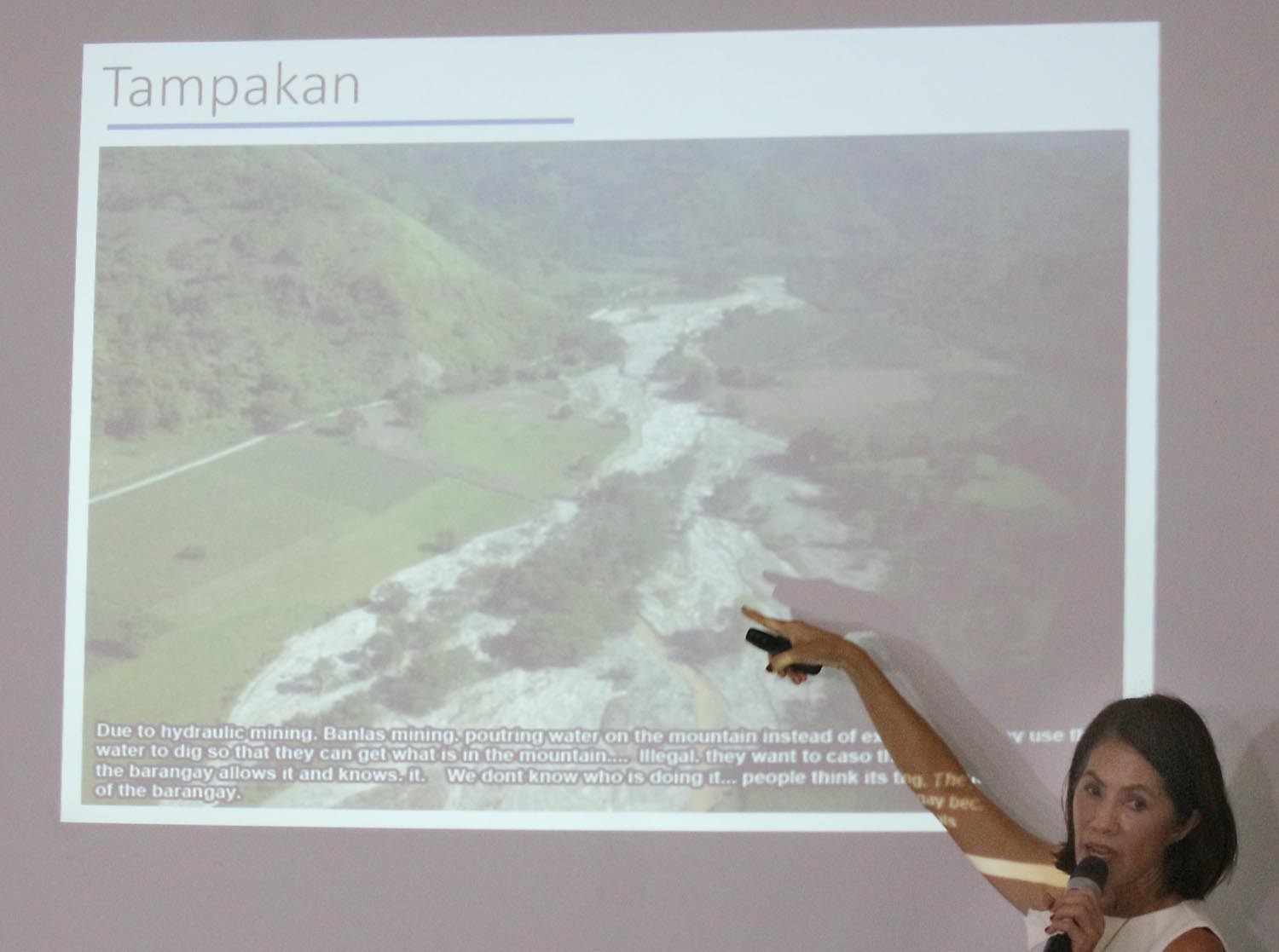 OPEN-PIT MINING. Environment Secretary Gina Lopez shows photos of Tampakan. Photo by Joel Liporada/Rappler   