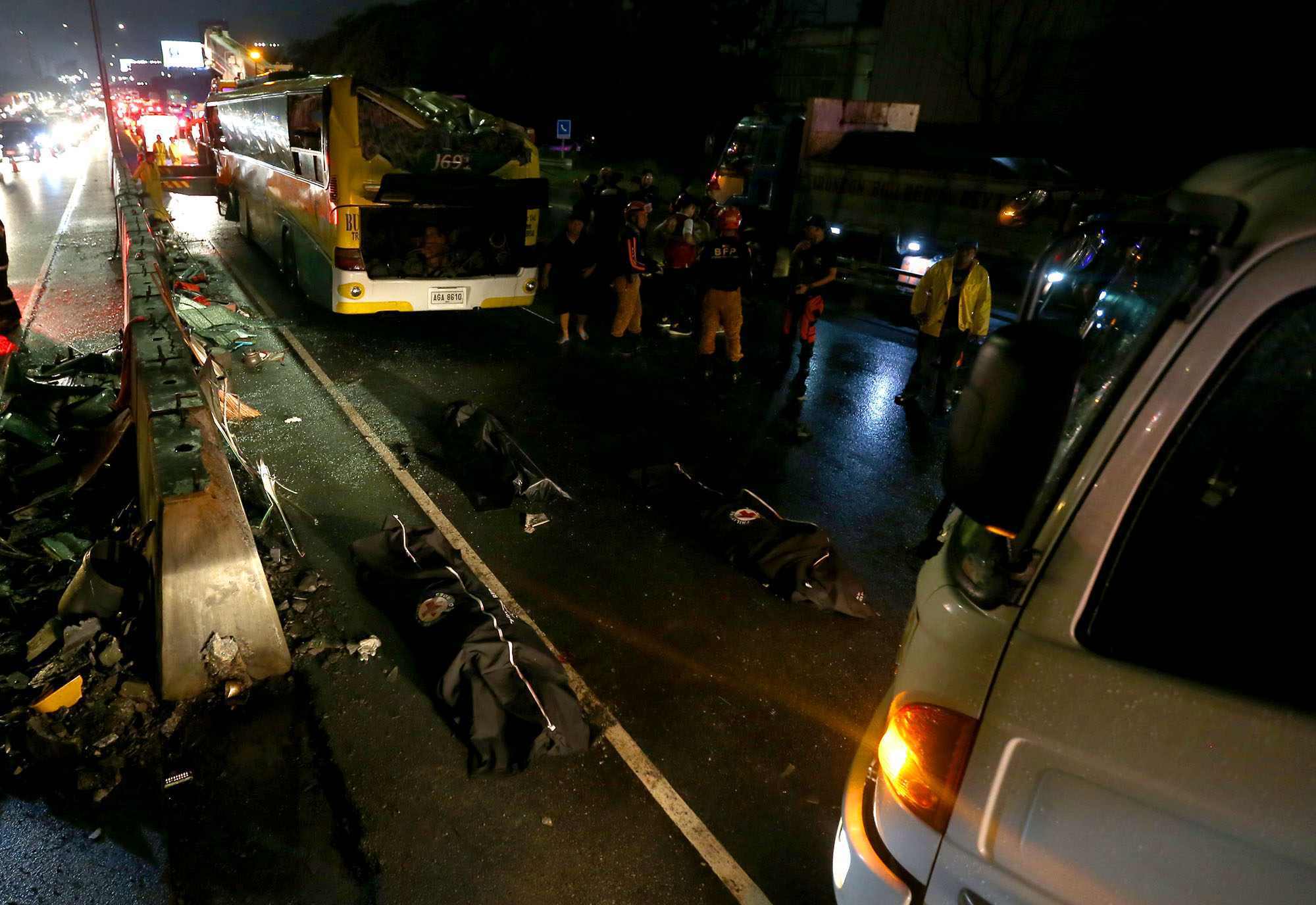 CRASH SITE. Body bags bearing the remains of bus passengers killed in the NLEX road crash on June 28, 2019. Photo by Inoue Jaena/Rappler
 