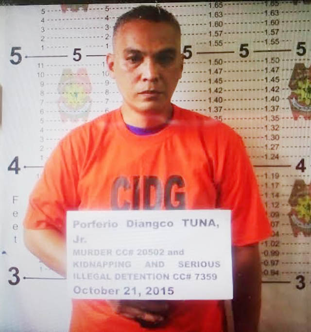 'KA SIMON.' Porferio Tuna Jr, allegedly the deputy secretary general and
spokesperson of the New People's Army in southeastern Mindanao Region, is arrested by police and the military in Tagum City on October 21, 2015. Photo courtesy of CIDG 
