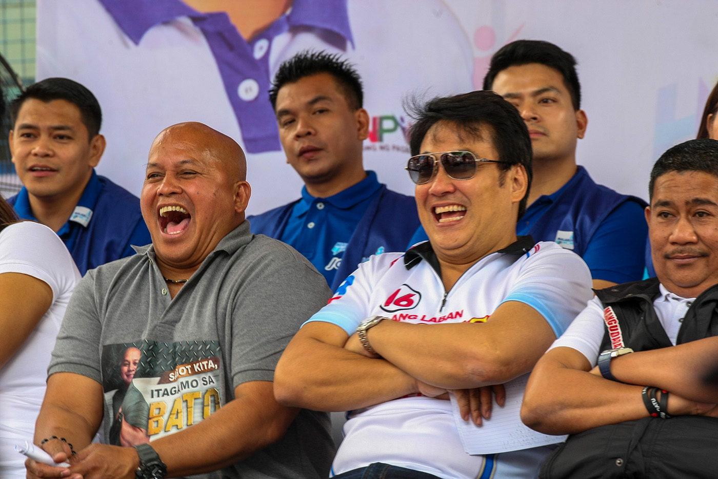 WEIGHING IN ON ISSUES. Ronald dela Rosa (left) sits beside Bong Revilla and other Hugpong ng Pagbabago candidates during a campaign rally. Photo by Maria Tan/Rappler 