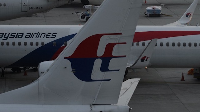 Malaysia Airlines planes are seen at departure gates at Kuala Lumpur International Airport (KLIA) in Sepang on March 8, 2015. Mohd Rasfan/AFP 