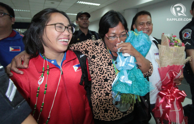 GREAT TIMES. Hidilyn Diaz (in red), seen here with her mom, has returned to the Philippines. Photo by Jedwin M Llobrera/Rappler  