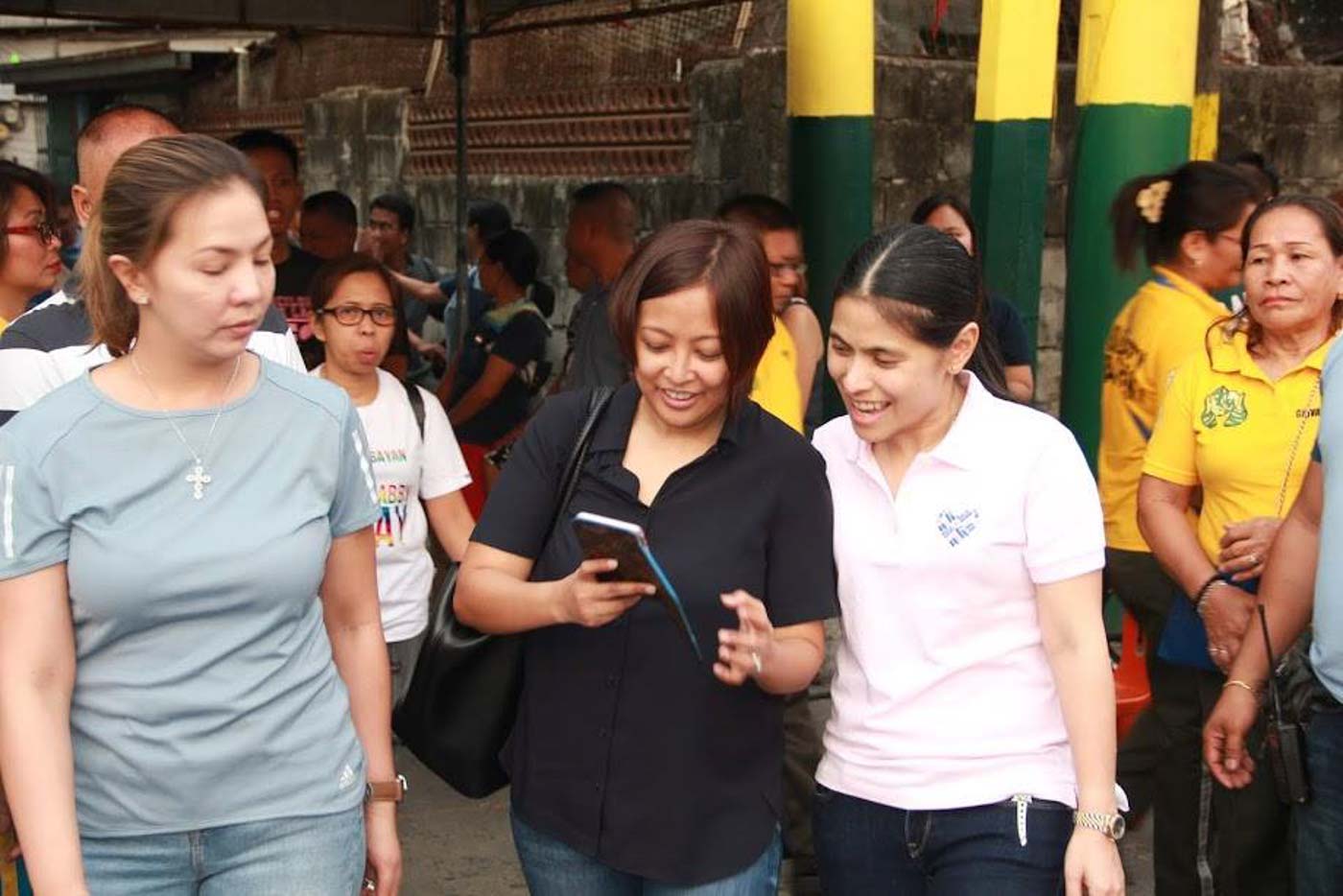 THE WONDER TWINS. Mayor Abby Binay checks out her phone as Vice Mayor Monique Lagdameo, Abby's longtime friend and ally, looks on. Photo from the Makati City government  