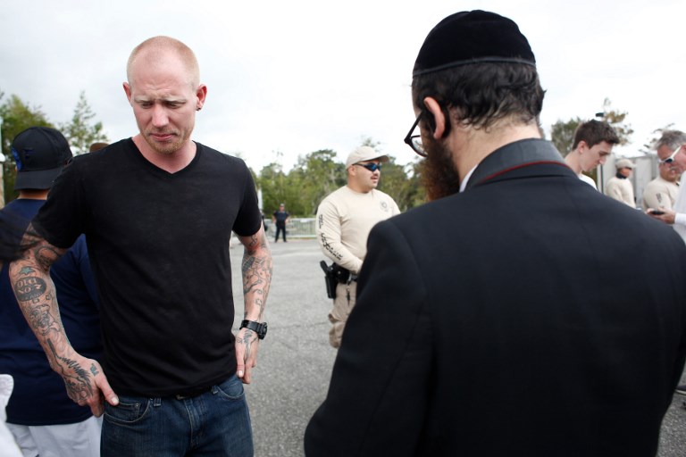 WHITE NATIONALIST. Self-described white nationalist Tyler Tenbrink, of Houston, Texas (left) is arrested, along with friends William Fears and Tyler Fears, in relation to a shooting following the speech. Photo by Brian Blanco/AFP 