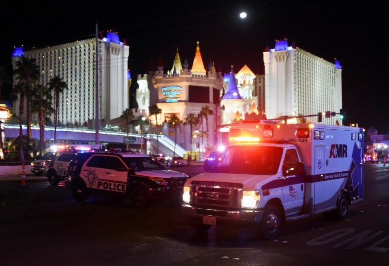 SHOOTING. An ambulance leaves the intersection of Las Vegas Boulevard and Tropicana Ave. after a mass shooting at a country music festival nearby on October 2, 2017 in Las Vegas, Nevada. Photo by Ethan Miller/Getty Images/AFP 