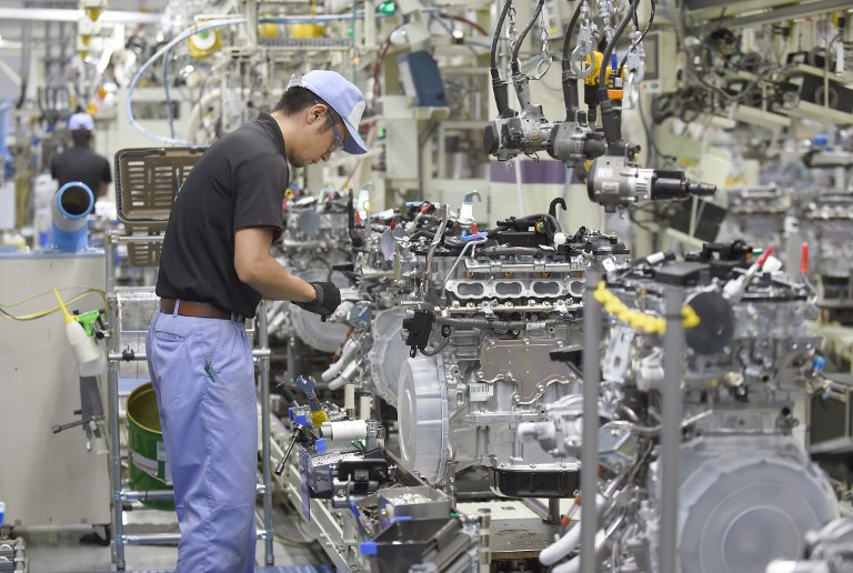 TOYOTA. An employee of Toyota Motor's subsidiary Toyota Motor Kyushu assembles a new 2-liter gasoline turbo engine '8AR-FTS' at the Kanda Plant in Kanda, Fukuoka Prefecture, on August 7, 2014. File photo by Toru Yamanaka/AFP 