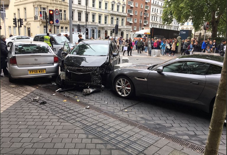 LONDON INCIDENT. A handout picture obtained from the twitter user @StefanoSutter shows damaged vehicles on Exhibition Road, in between the Victoria and Albert (V&A) museum, and the Natural History Museum, in London on October 7, 2017, following an incident in South Kensington. Photo by Stefano Sutter/AFP  