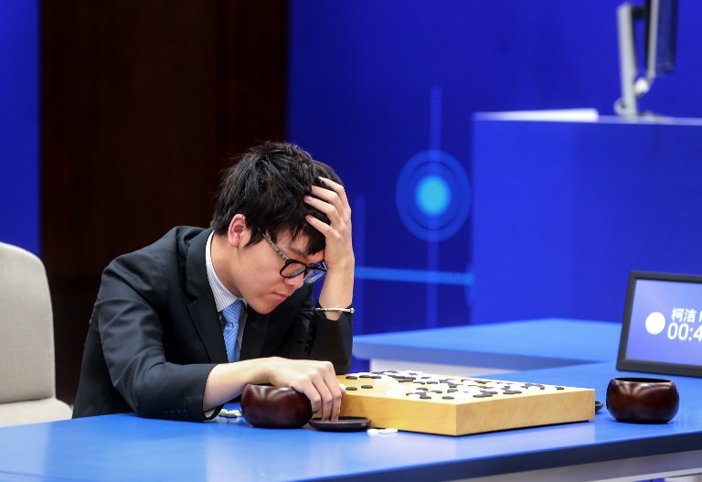 ALPHAGO WINS. China's 19-year-old Go player Ke Jie reacts during the second match against Google's artificial intelligence program AlphaGo in Wuzhen, eastern China's Zhejiang province on May 25, 2017.  Photo by AFP 