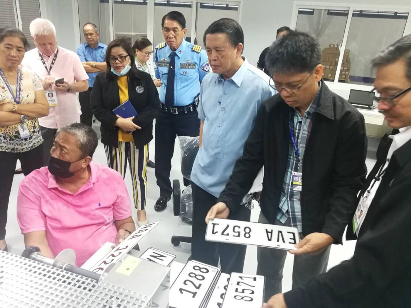 LICENSE PLATES. Transportation Secretary Arthur Tugade (left) inspects the motor vehicle plate facility of the Land Transportation Office on April 6, 2018. Photo from the Department of Transportation 
