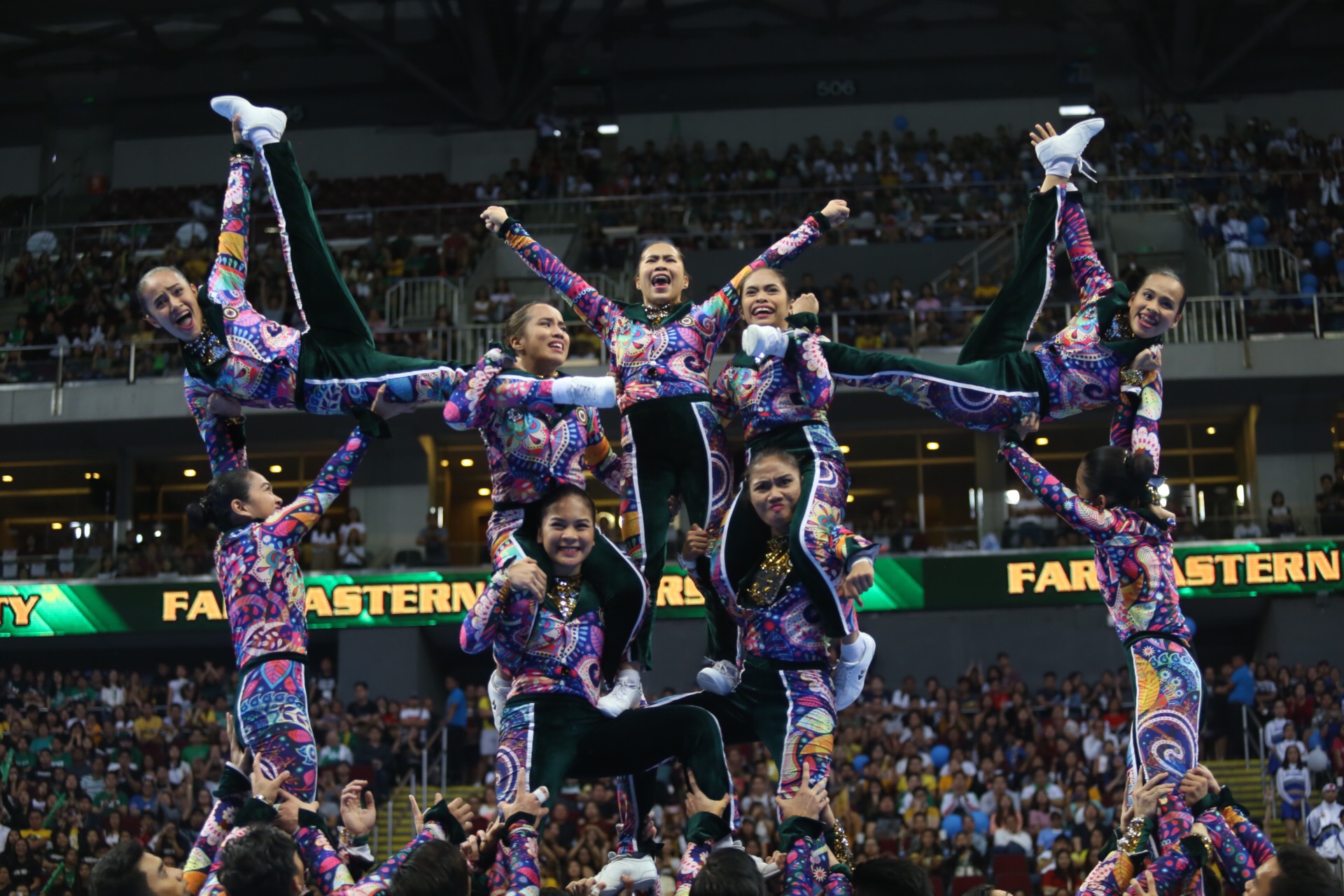 THROWBACK. The FEU Cheering Squad turns back time with a funky '70s show. Photo by Josh Albelda/Rappler  