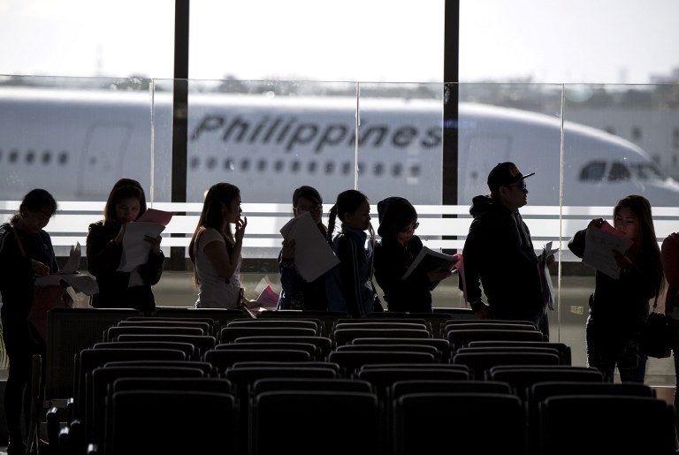 COME HOME. Filipina workers returning home from Kuwait arrive at Manila International Airport on February 18, 2018. File photo by Noel Celis /AFP 