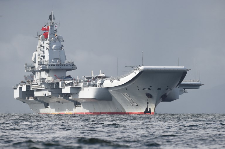 INNOCENT PASSAGE. China's sole operational aircraft carrier, the Liaoning, arrives in Hong Kong waters on July 7, 2017, less than a week after a high-profile visit by President Xi Jinping. China's national defense ministry had said the Liaoning, named after a northeastern Chinese province, was part of a flotilla on a "routine training mission" and would make a port call in the former British colony. File photo by AFP