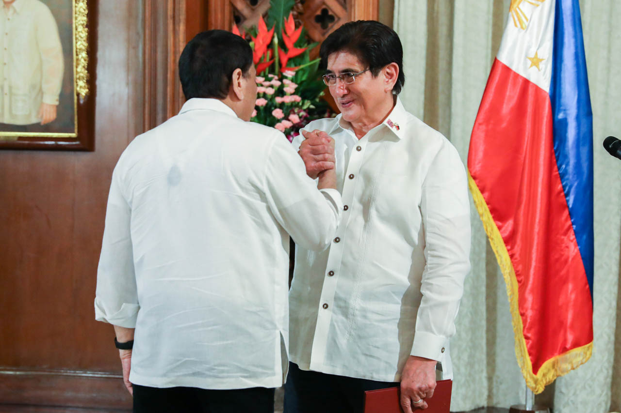 JOINING THE CABINET. President Rodrigo Duterte congratulates new Information and Communications Technology Secretary Gregorio Honasan II during the oath-taking ceremony at Malacañang Palace on July 1, 2019. Malacañang photo 