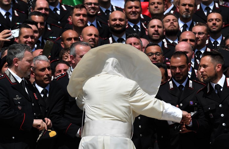 POPE'S AUDIENCE. A gust of wind blows Pope Francis' mantel as he meets the Carabinieri during the general audience at Saint Peters Square, Vatican City on May 30, 2018. Photo by Tiziana Fabi/AFP  
