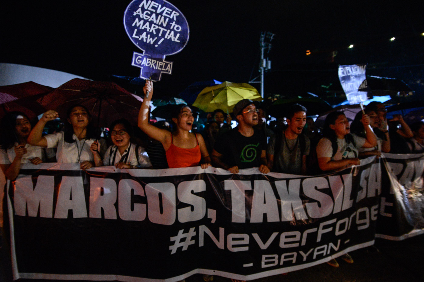 KATIPUNAN TAKEOVER. Rain fails to dampen the spirits of students from the University of the Philippines, Ateneo De Manila University, and Miriam College as thousands walk out of their classes to protest along Katipunan Avenue in Quezon City the burial of former president Marcos at the Libingan ng mga Bayani on November 18, 2016. Photo by LeAnne Jazul/Rappler  