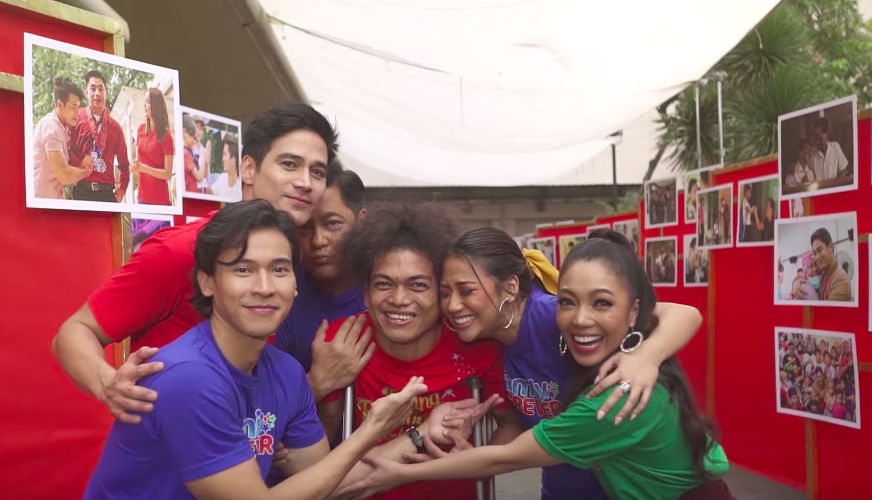 FAMILY IS FOREVER. ABS-CBN's artists and News and Current Affairs staff reunite with the people featured in past ABS-CBN station IDS. Screenshot from YouTube/ABS-CBN Entertainment  