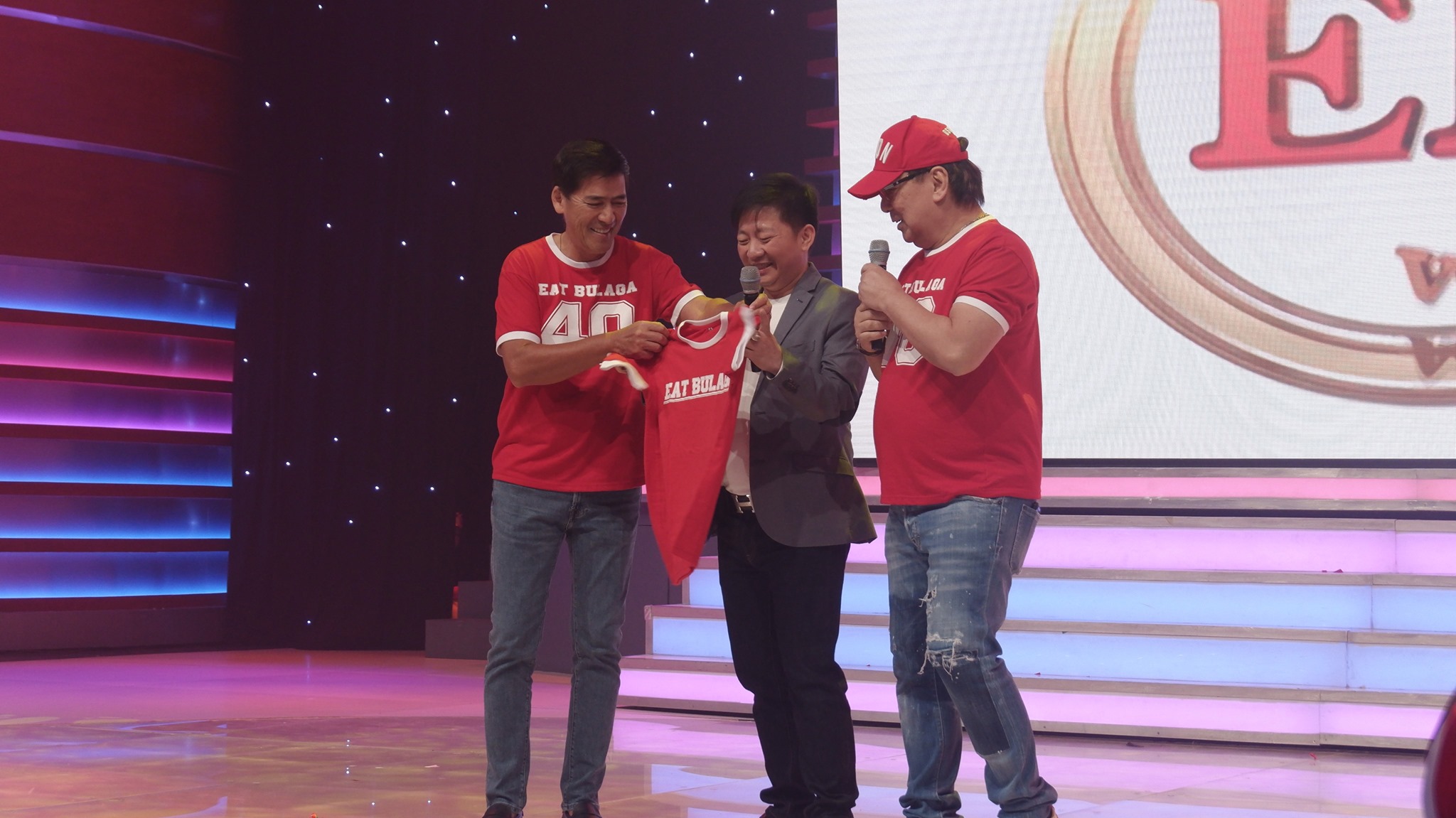 MYANMAR BOUND. Vic Sotto and Joey de Leon present a red Eat Bulaga t-shirt to Captain Aung Po who will handle the Myanmar franchise of the show. Photo form Facebook/Eat Bulaga 