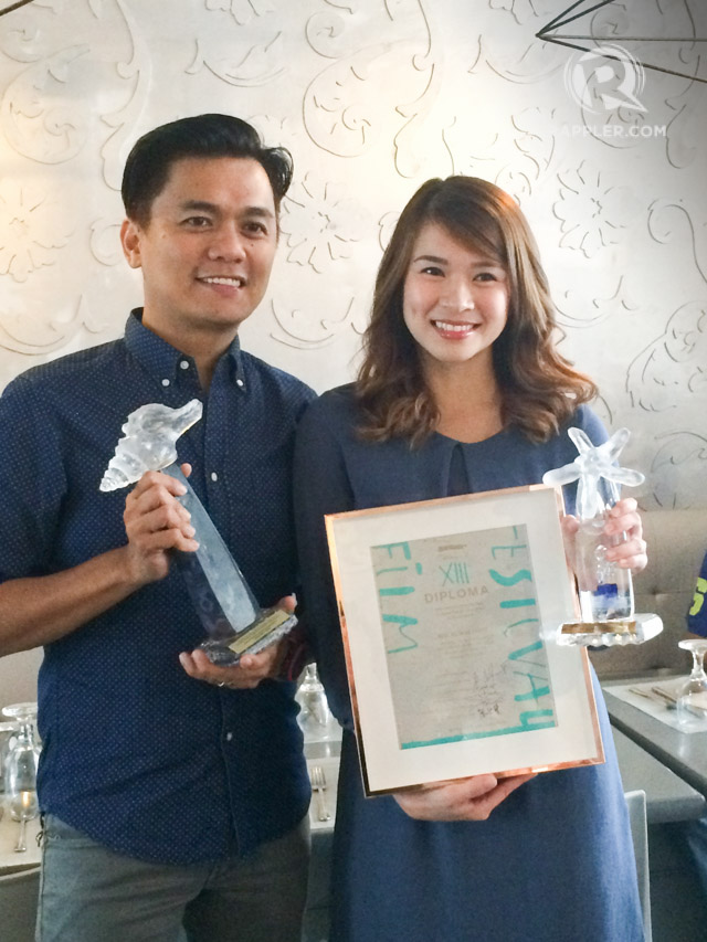 BEST DIRECTOR AND ACTRESS. Director Jun Lana and actress LJ Reyes show their awards after winning the top honors at the 13th Pacific Meridian Film Festival in Russia for the movie 'Anino sa Likod ng Buwan.' Photo by Alexa Villano/Rappler   
