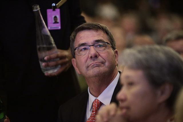 'HALT LAND RECLAMATION.' US Defense Secretary Ashton Carter looks on during the keynote on the first day of the International Institute for Strategic Studies (IISS) 14th Asia Security Summit in Singapore, 29 May 2015. Photo by Wallace Woon/EPA 