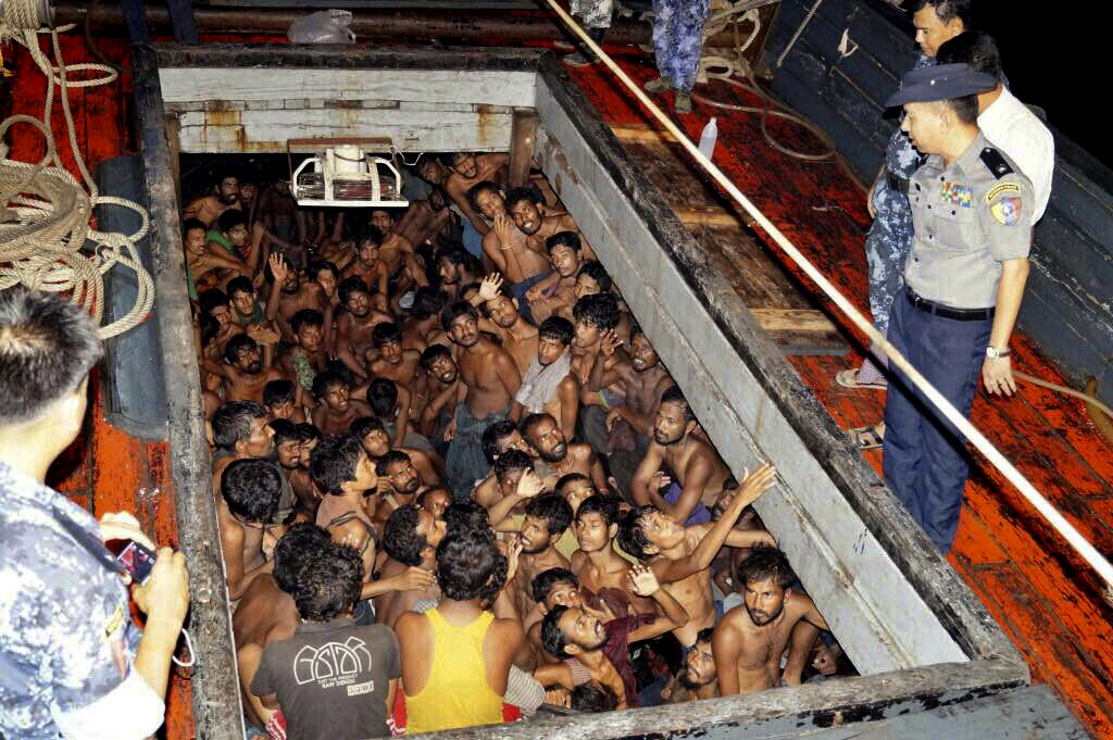 REFUGEE CRISIS. In this handout photo released May 22, 2015, the Myanmar navy rescues a boat loaded with 219 migrants, most of them from Bangladesh according to a government website. Malaysia and Indonesia say they would start helping thousands of Rohingya migrants on boats off their shores. Handout photo from Myanmar Information Ministry/EPA   