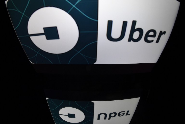 UBER. A picture taken on December 28, 2016 in Paris shows the logo of Uber. 
File photo by Lionel Bonaventure/AFP 