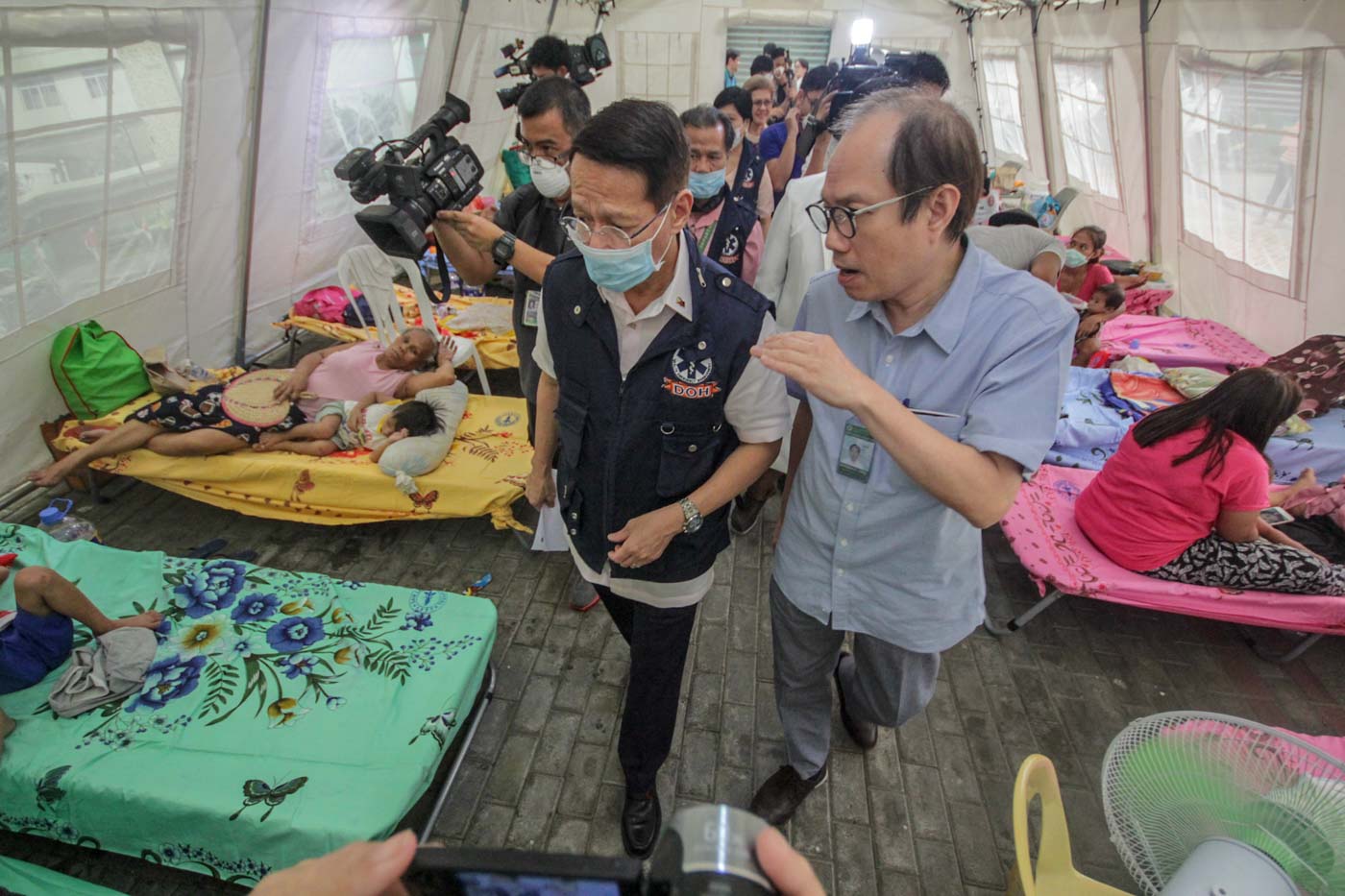 OUTBREAK RESPONSE. Health Secretary Francisco Duque inspects tents set up to treat the influx of measles patients at San Lazaro Hospital in Manila on 13 February 2019. Photo by Lito Borras/Rappler 