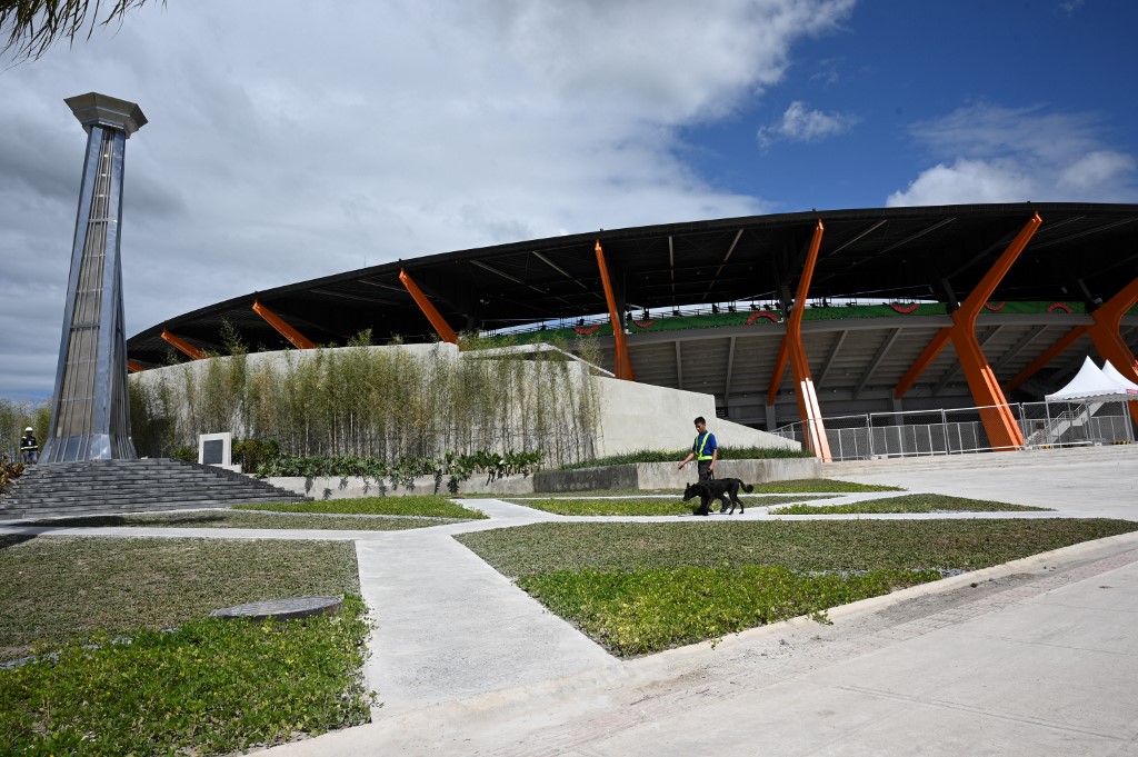 CAULDRON. A security personnel walks past the cauldron in front of the athletics stadium in New Clark City, in Capas town, Tarlac province north of Manila on November 26, 2019. Photo by Ted Aljibe/AFP  