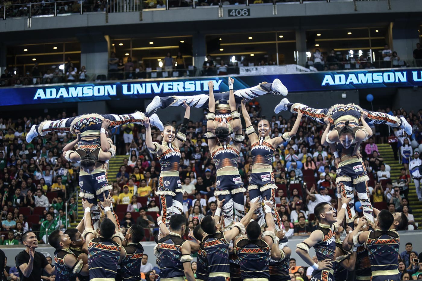 OVERPOWERING. The Adamson Pep Squad flashes some tough stunts to edge out traditional powerhouse UST for the last spot on the podium. Photo by Josh Albelda/Rappler   