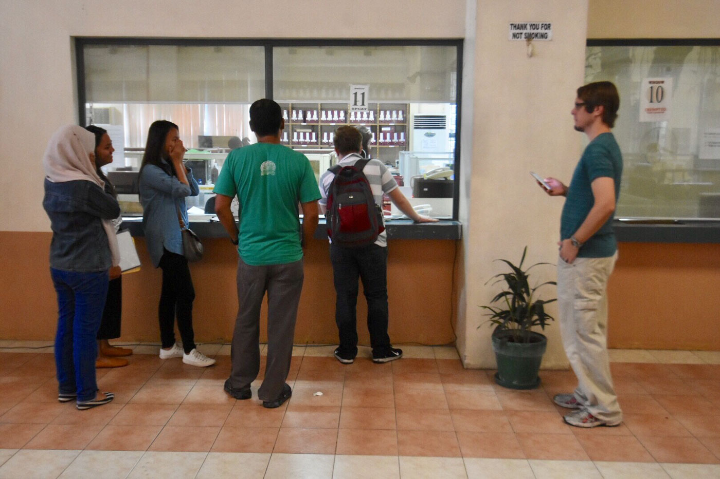 TEARY-EYED. Caalaman (3rd from right) asks the admission officer if she could take the exam in the afternoon after being denied entry to her testing room for arriving late 