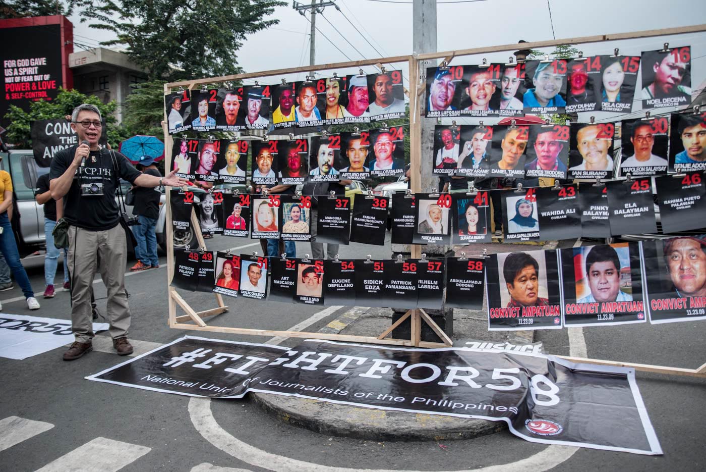 AMPATUAN MASSACRE. PCP Chairperson Jun Sepe pictured beside the images of the victims of Maguindanao Massacre on November 23, 2019. Photo by Lisa Marie David/Rappler 
