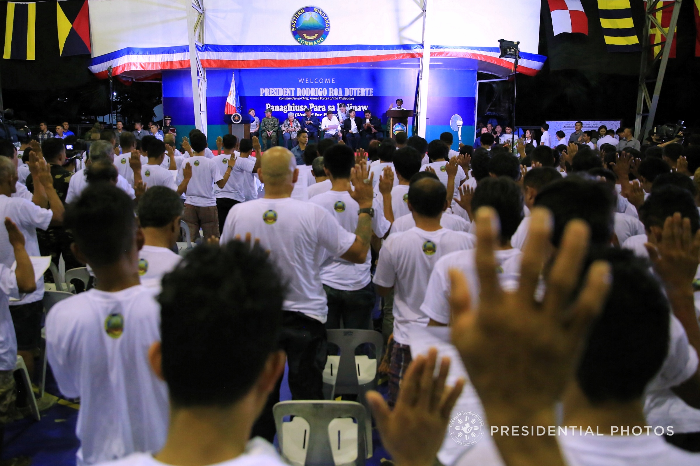 RETURN. Duterte leads the oath of allegiance for former communist rebels in Davao City. Malacañang photo   
