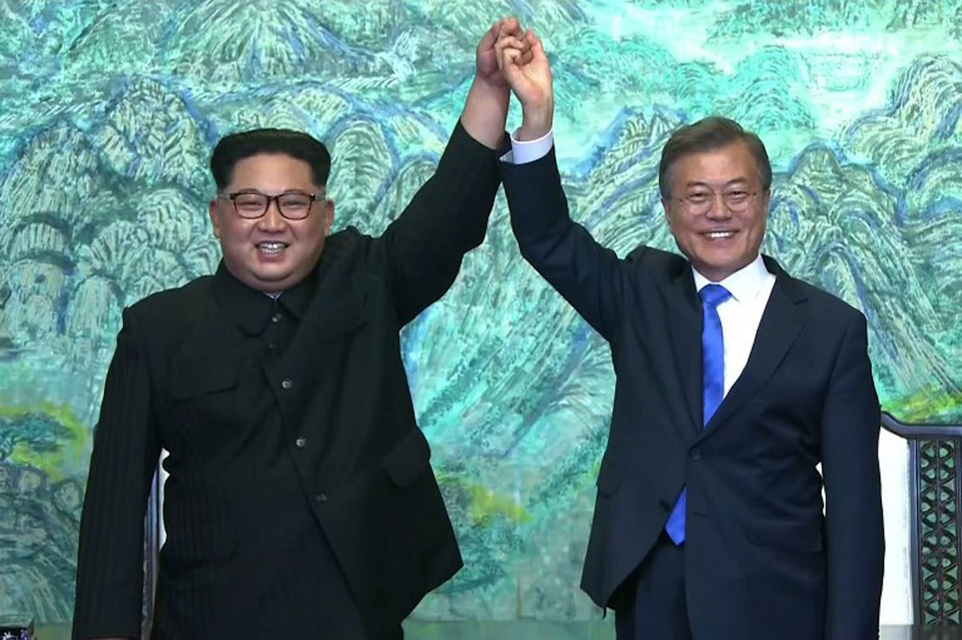 PANMUNJEOM DECLARATION. This screen grab from the Korean Broadcasting System (KBS) taken on April 27, 2018 shows North Korea's leader Kim Jong Un (L) and South Korea's President Moon Jae-in (R) joining hands near the end of their historic summit at Panmunjom. AFP PHOTO / KOREAN BROADCASTING SYSTEM 