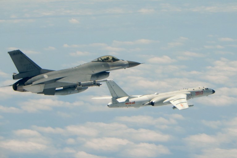CHINA BOMBERS. This handout photograph taken and released on May 11, 2018 by Taiwan's Defense Ministry shows a Republic of China (Taiwan) Air Force F-16 fighter aircraft (left) flying alongside a Chinese People's Liberation Army Air Force (PLAAF) H-6K bomber that reportedly flew over the Bashi Channel, south of Taiwan, and over the Miyako Strait, near Japan's Okinawa Island, in a drill.  AFP/Taiwan
 Defense Ministry/ Handout 