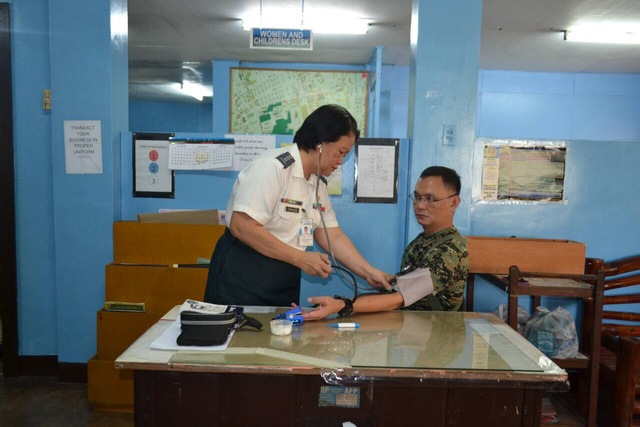 EX-PDEA EXEC. Marine Lieutenant Colonel Ferdinand Marcelino, former official of the Philippine Drug Enforcement Agency, gets a medical check up after surrendering to the Armed Forces of the Philippines on January 3, 2017. Photo courtesy of Armed Forces of the Philippines 