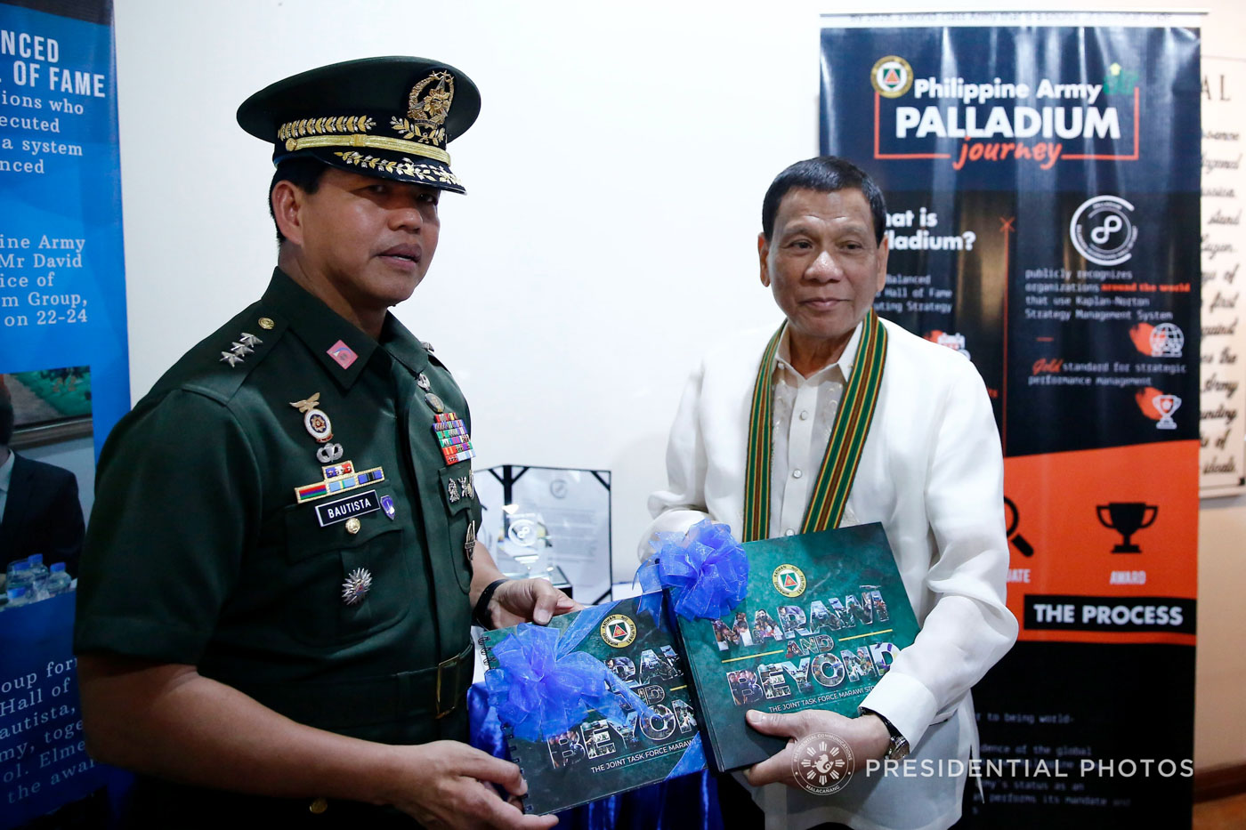 MARAWI AND BEYOND. President Rodrigo Duterte receives a copy of the book 'Marawi and Beyond' from Army chief Lieutenant General Rolando Bautista. 