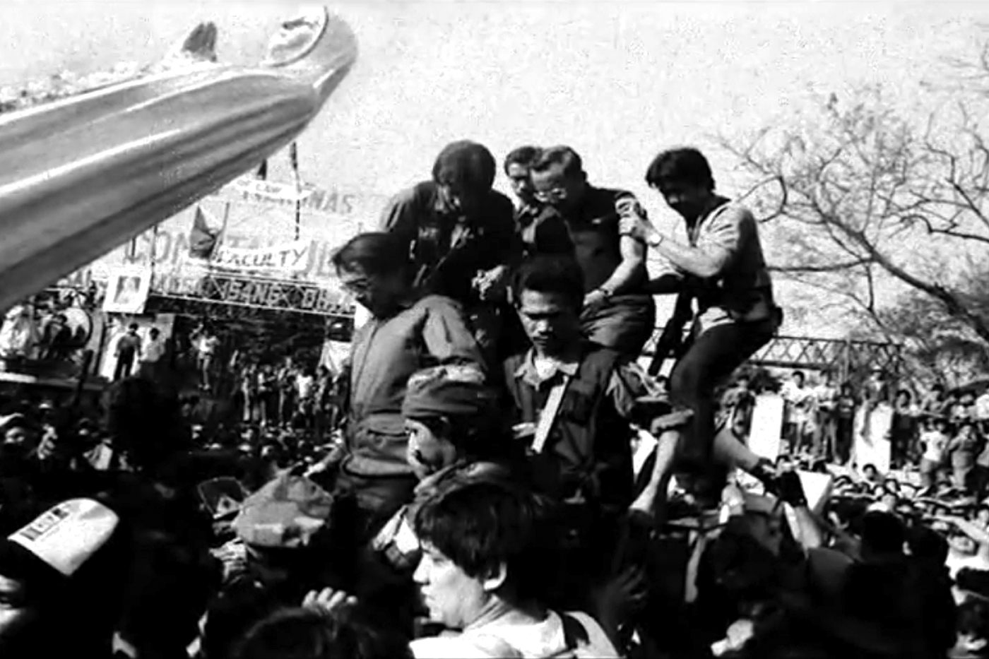 REVOLUTION LEADERS. Fidel Ramos (middle, wearing glasses) being assisted by some  RAM soldiers led by Honasan (left of Ramos) during the EDSA People Power on February 22, 1986. Photo by Romeo Mariano   