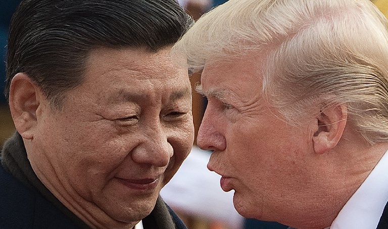 TRADE WARS. In this file photo, China's President Xi Jinping (L) and US President Donald Trump attend a welcome ceremony at the Great Hall of the People in Beijing on November 9, 2017. File photo Nicolas Asfouri/AFP   