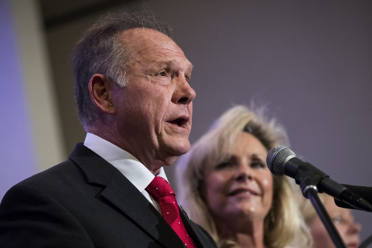 ENDORSED BY TRUMP. In this file photo, Republican candidate for U.S. Senate Judge Roy Moore speaks as his wife Kayla Moore looks on during a news conference with supporters and faith leaders, November 16, 2017 in Birmingham, Alabama. Drew Angerer/Getty Images 