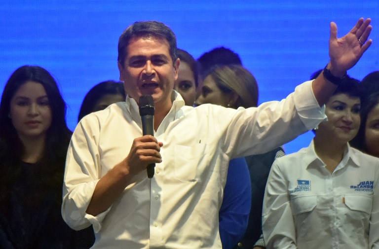 ANOTHER TERM? Honduran President and presidential candidate Juan Orlando Hernandez waves to supporters in Tegucigalpa after the general elections on November 26, 2017. Rodrigo Arangua/AFP 