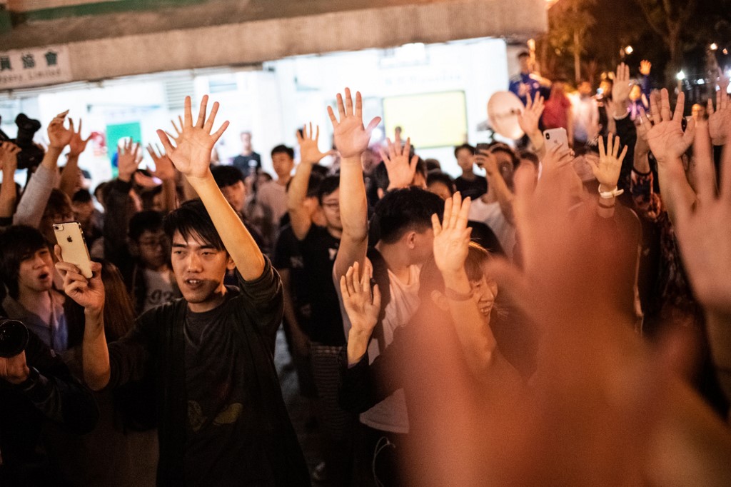 HONG KONG ELECTIONS. Pro-democracy supporters celebrate after pro-Beijing candidate Junius Ho lost a seat in the district council elections in Tuen Mun district of Hong Kong, early on November 25, 2019. Photo by Philip Fong/AFP 