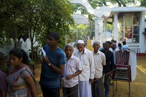 VOTING. Sri Lankan voters queue up to cast their ballots at a polling station during the country's presidential election in Colombo on November 16, 2019. Photo by Jewel Samad/AFP 