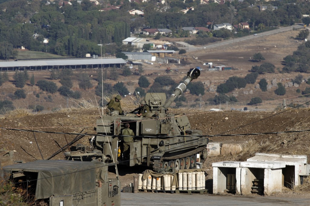 ISRAEL AND SYRIA. Israeli soldiers and armored vehicles are pictured on November 19, 2019, near the border with Syria in the annexed Golan Heights. Israel's anti-missile defense system intercepted four rockets fired from neighboring Syria, the army says. Photo by Jalaa Marey/AFP 
