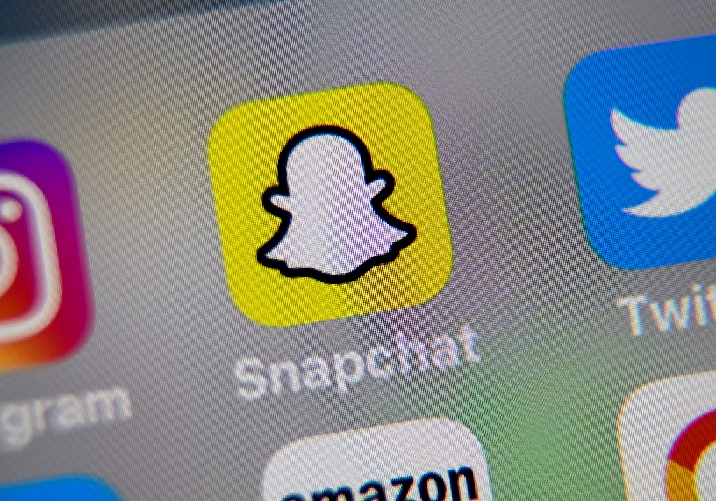 SNAPCHAT. A picture taken on October 1, 2019 in Lille shows the logo of mobile app Snapchat displayed on a tablet. (Photo by Denis Charlet/AFP 