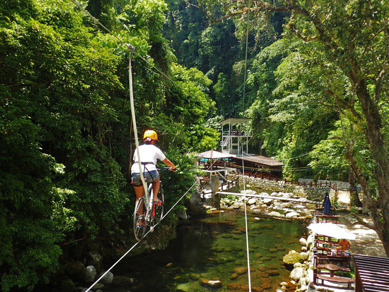 ZIPBIKING. This is similar to and is exciting like ziplining, except that you ride on a bike. Photo taken at Panicuason Hot Springs, Naga City 