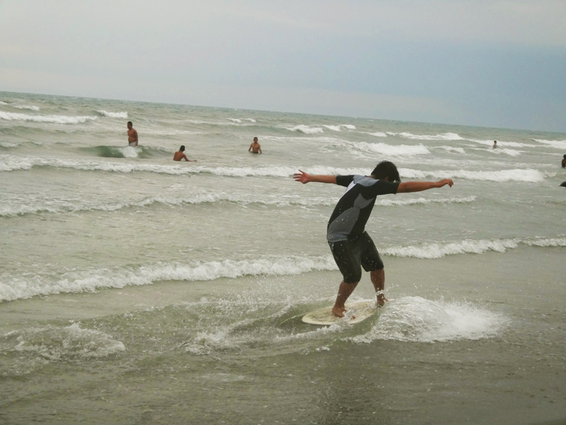 SKIMBOARDING. A fun activity that lets you ride breaking waves near the shore 